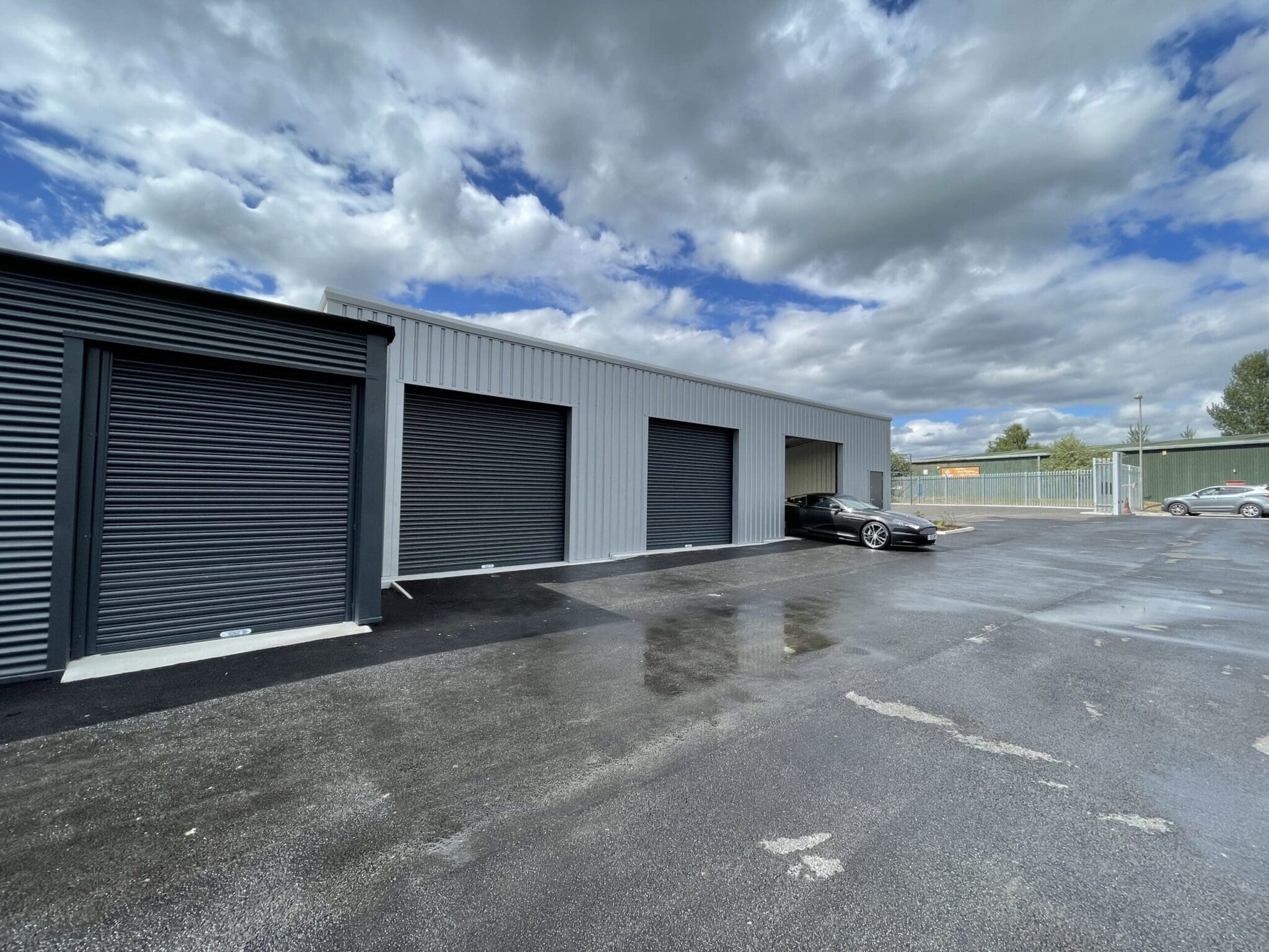 a storage facility with a black roller shutter